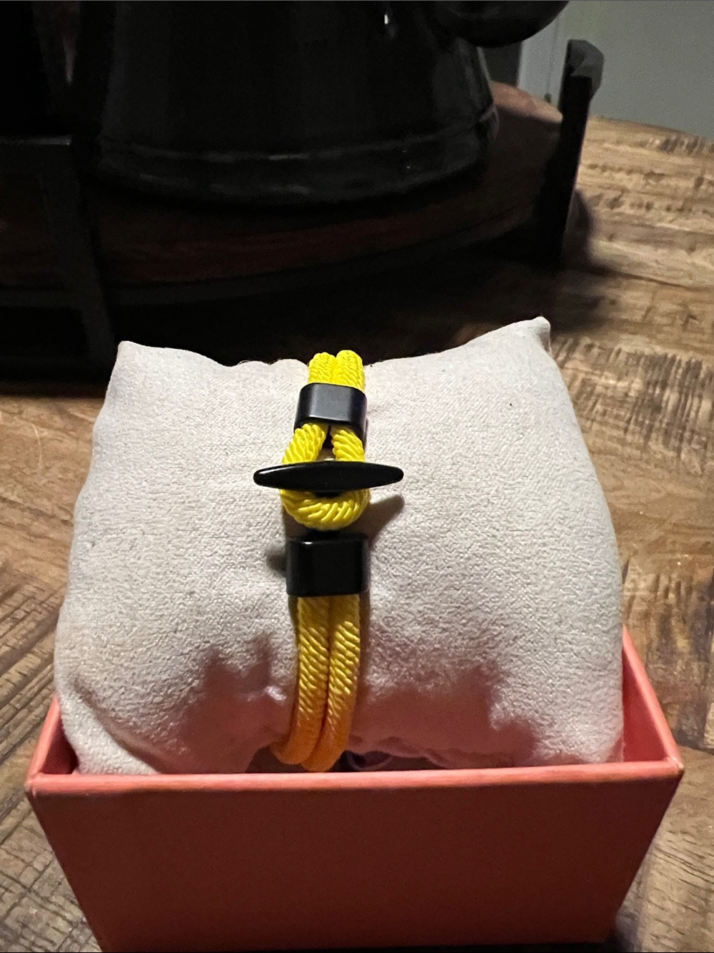 Yellow boat anchor and whale tale bracelet.